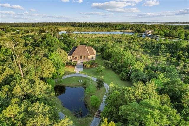Discover this waterfront oasis on approximately 13 acres, with - Beach Home for sale in Slidell, Louisiana on Beachhouse.com