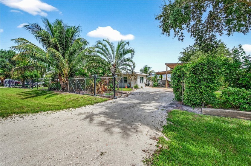 Fully fenced .38-acre CH-zoned property with tropical - Beach Home for sale in Vero Beach, Florida on Beachhouse.com