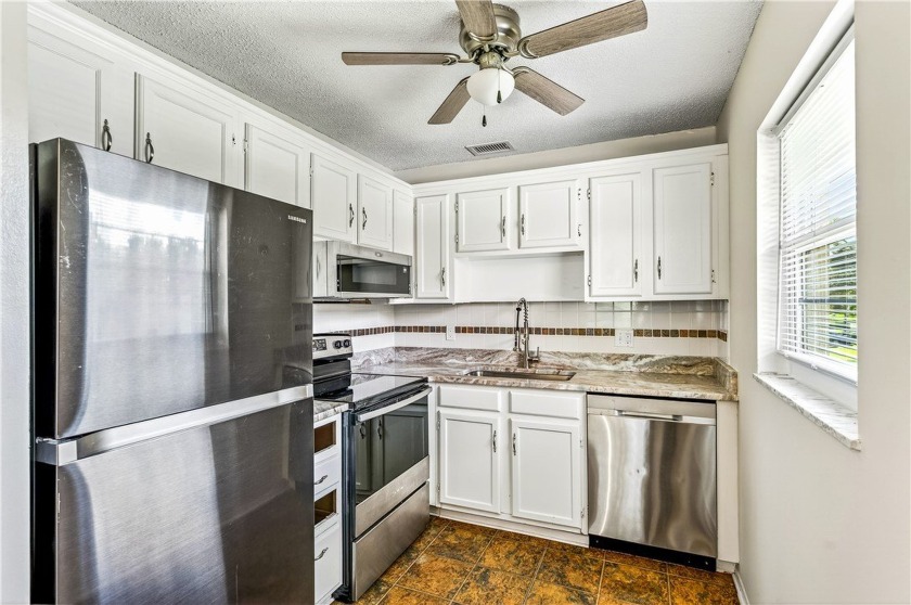 Embrace the vibrant 55+ lifestyle in this sun-drenched 1BR/1.5BA - Beach Condo for sale in Vero Beach, Florida on Beachhouse.com