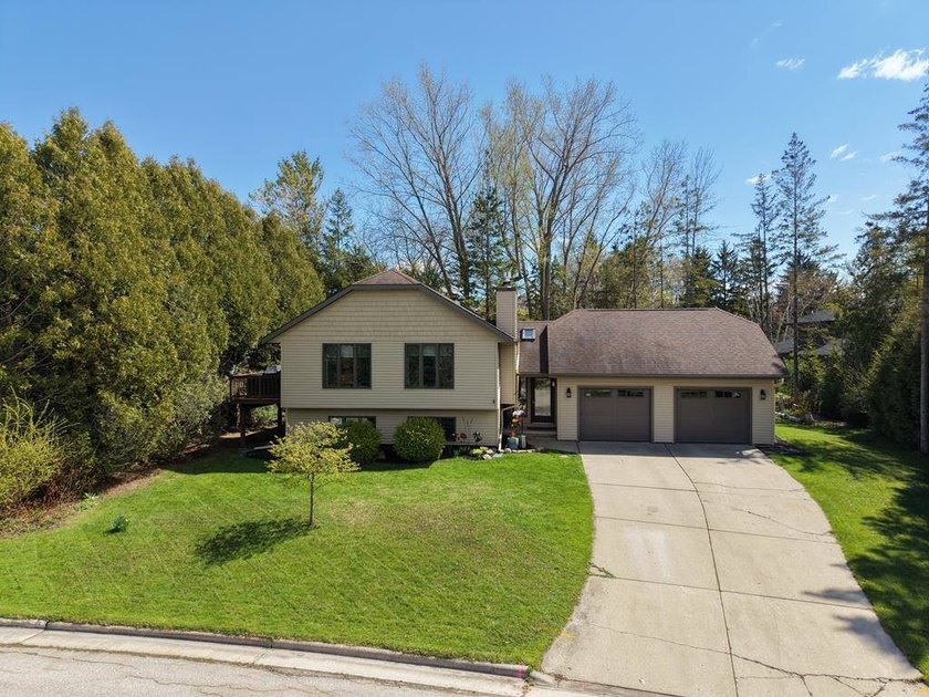 Set in the Purves Lagoon neighborhood, this remodeled - Beach Home for sale in Sturgeon Bay, Wisconsin on Beachhouse.com