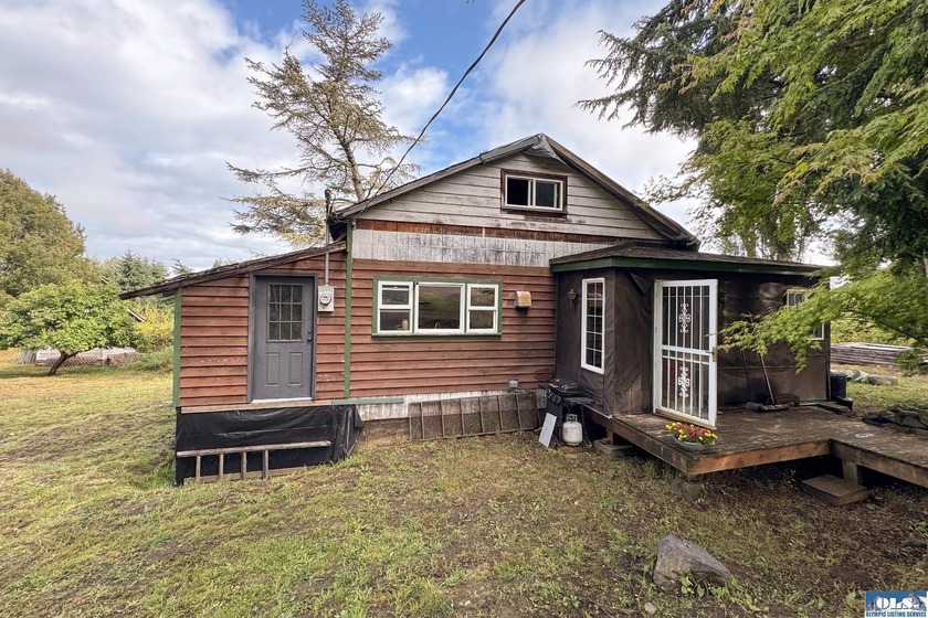 This 1924 Farmhouse that needs some TLC but has a lot of - Beach Home for sale in Port Angeles, Washington on Beachhouse.com