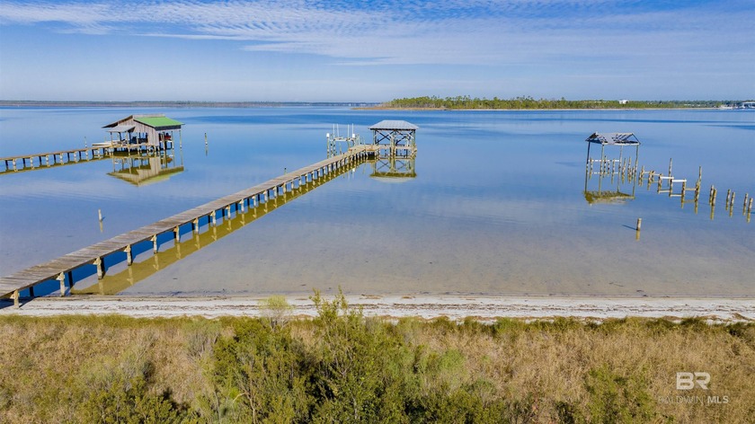 Rare Waterfront Opportunity: Sunsets, Sand, and SerenityDiscover - Beach Lot for sale in Orange Beach, Alabama on Beachhouse.com