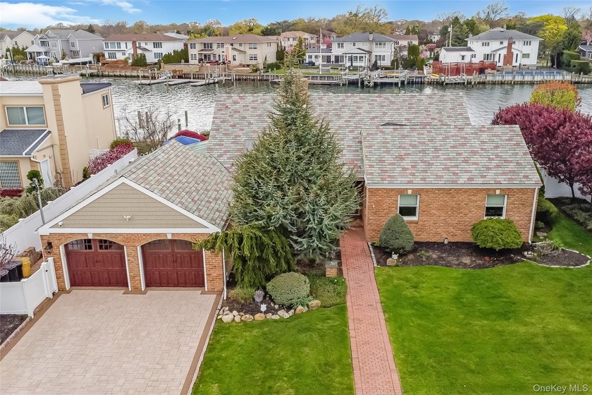 Set along the picturesque Jones River in the highly sought-after - Beach Home for sale in Massapequa, New York on Beachhouse.com