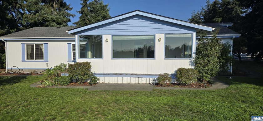 Step into this beautifully maintained home, perfectly positioned - Beach Home for sale in Sequim, Washington on Beachhouse.com