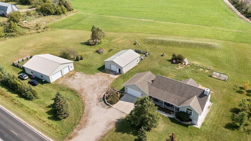 This stunning open-concept 4-bedroom Ranch on 4.73 acres offers - Beach Home for sale in Oostburg, Wisconsin on Beachhouse.com