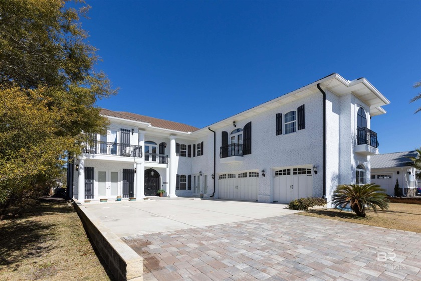 Set on a quiet canal on Ono Island, this six-bedroom, five-bath - Beach Home for sale in Orange Beach, Alabama on Beachhouse.com