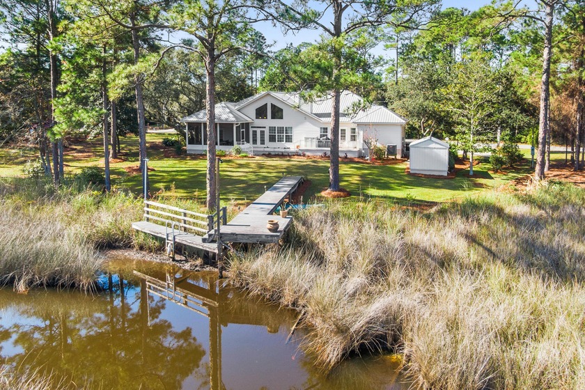 A refined waterfront estate on two lots spanning 325 feet, this - Beach Home for sale in Santa Rosa Beach, Florida on Beachhouse.com
