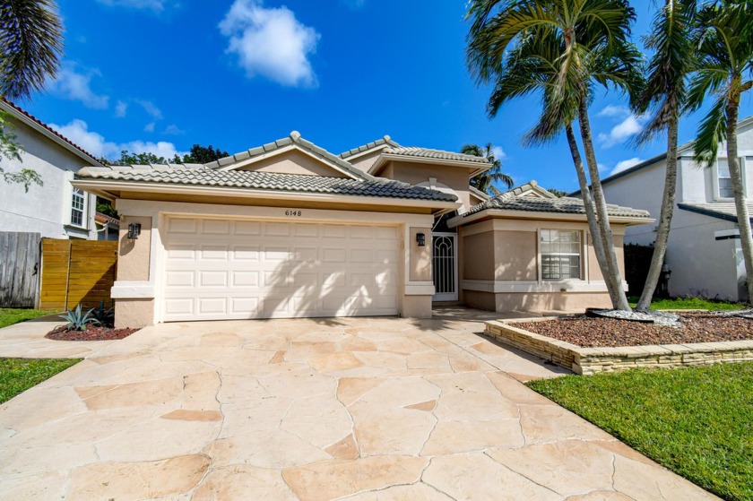 This home is nestled in the gated community of the Estates of - Beach Home for sale in Boynton Beach, Florida on Beachhouse.com