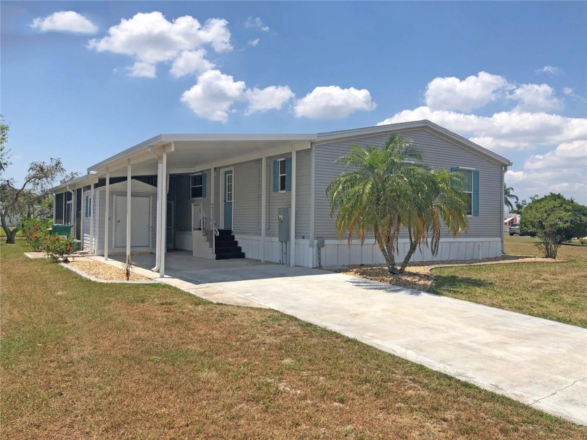 Impressive *FURNISHED* 2 Bedroom, 2 Bathroom home with Carport - Beach Home for sale in Punta Gorda, Florida on Beachhouse.com