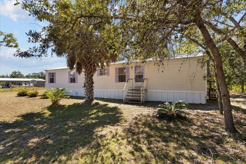 Fully furnished and move-in ready, this 3-bedroom, 2-bath mobile - Beach Home for sale in Keaton Beach, Florida on Beachhouse.com