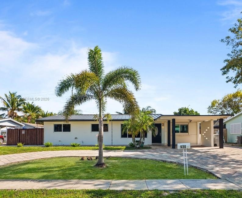 Step into this beautifully remodeled 4-bedroom, 2-bathroom home - Beach Home for sale in Pompano Beach, Florida on Beachhouse.com