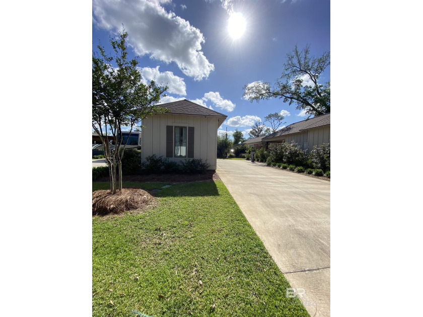 Step inside this beautiful, well appointed coach house situated - Beach Home for sale in Fairhope, Alabama on Beachhouse.com