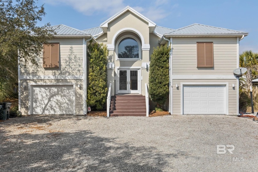 Stunning 5BR/3.5BA waterfront home located on a wide canal in - Beach Home for sale in Orange Beach, Alabama on Beachhouse.com
