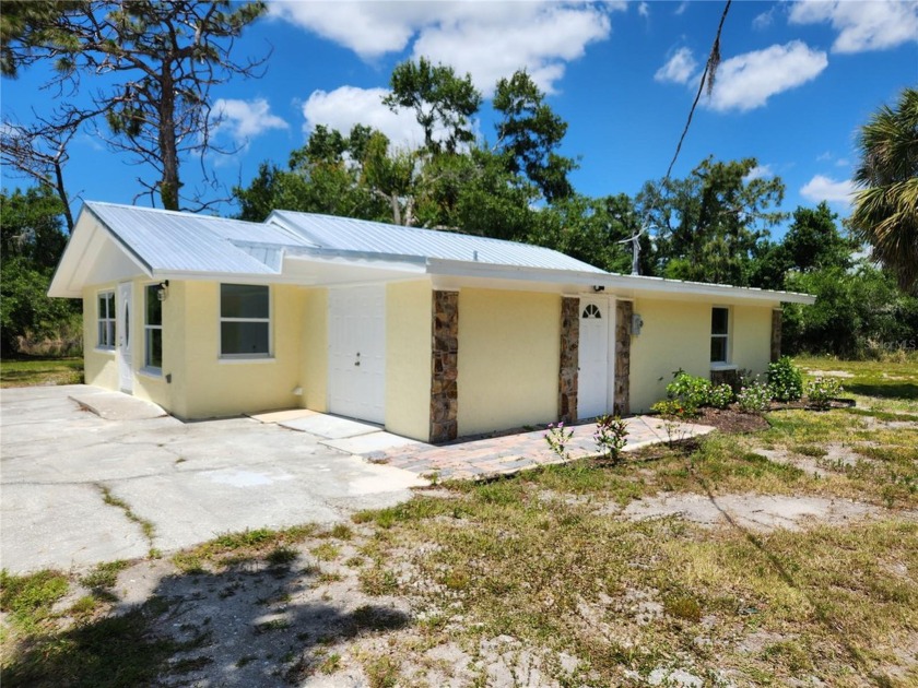 NICELY REMODELED HOME ON 1.29 ACRES ON A POND. Located just - Beach Home for sale in Englewood, Florida on Beachhouse.com