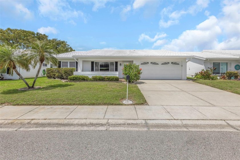 ENJOY ONE-OF-A-KIND WATER & GOLF COURSE VIEWS WITH - Beach Home for sale in Pinellas Park, Florida on Beachhouse.com