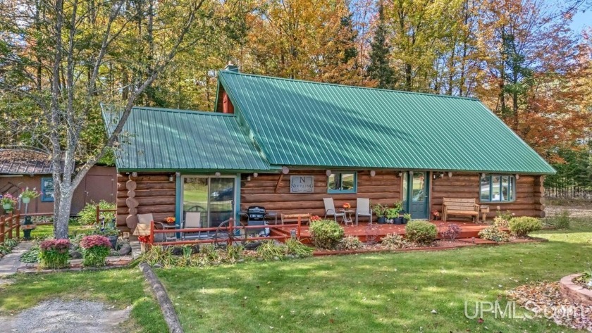 Log Home on 18 Acres! Escape to the woods in this charming 3 - Beach Home for sale in Rapid River, Michigan on Beachhouse.com