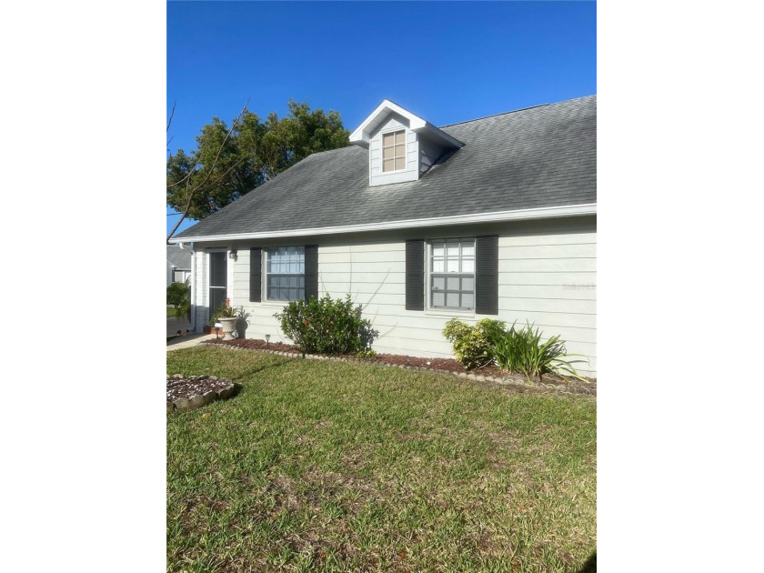 Welcome to this beautifully updated, move-in-ready villa in the - Beach Home for sale in New Port Richey, Florida on Beachhouse.com