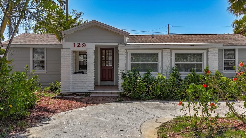 This sweet cottage home is nestled between the Gulf and the - Beach Home for sale in Treasure Island, Florida on Beachhouse.com