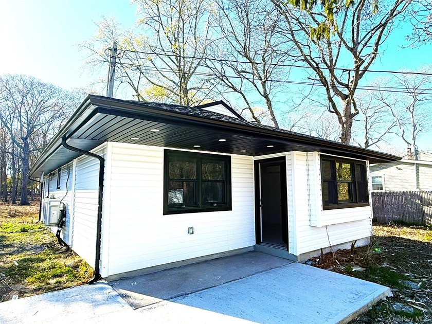 Welcome to this charming and well maintained home nestled in the - Beach Home for sale in Moriches, New York on Beachhouse.com