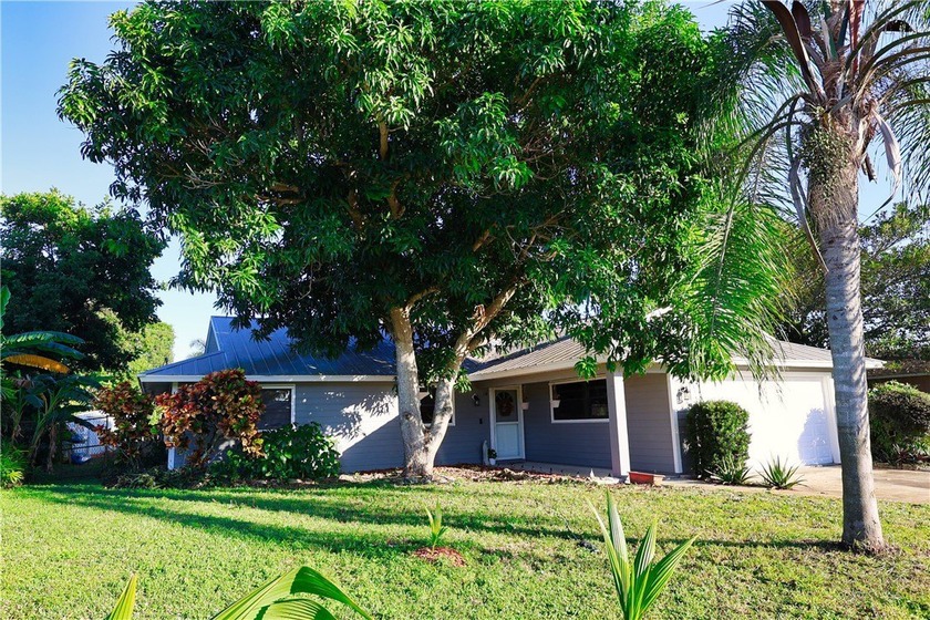 Charming 3/2 pool home featuring a durable metal roof and a - Beach Home for sale in Vero Beach, Florida on Beachhouse.com
