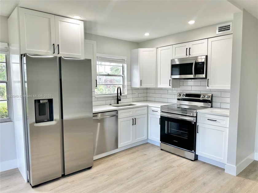 Welcome to this bright and renovated first-floor corner unit in - Beach Condo for sale in Deerfield Beach, Florida on Beachhouse.com