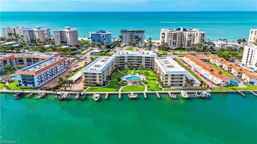 Nestled in the coveted Harbour Cove of The Moorings, this - Beach Condo for sale in Naples, Florida on Beachhouse.com