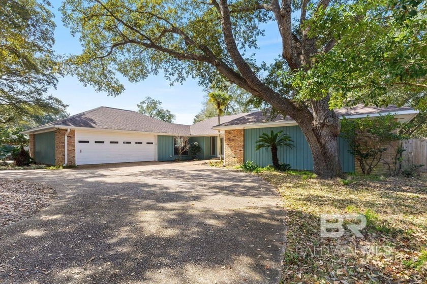 Welcome home to this beautifully maintained ranch-style retreat - Beach Home for sale in Gulf Shores, Alabama on Beachhouse.com