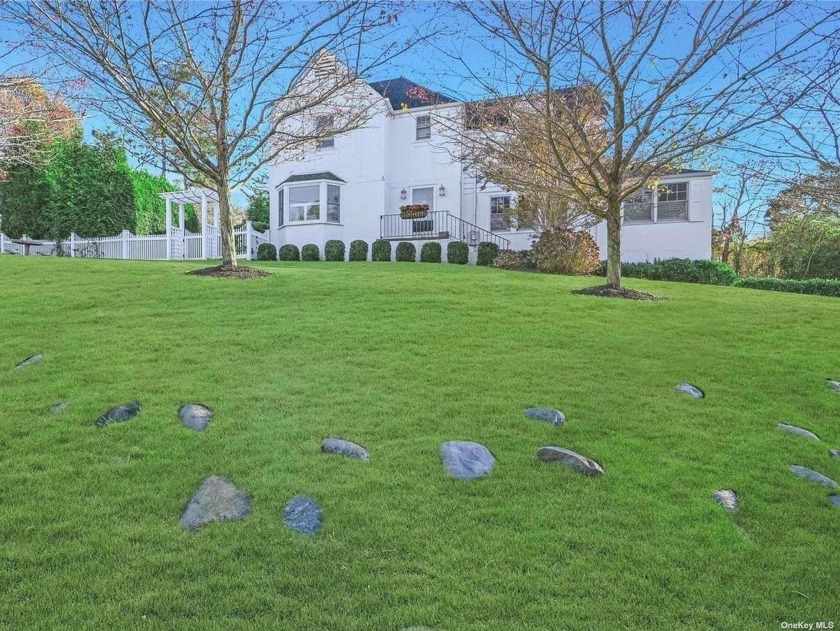 Welcome to this enchanting 1929 classic colonial nestled in the - Beach Home for sale in Huntington Bay, New York on Beachhouse.com