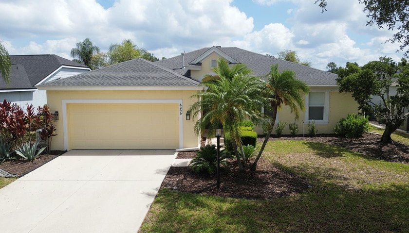 Stunning Lakeside Oasis with PRIVATE Heated Saltwater POOL & - Beach Home for sale in Lakewood Ranch, Florida on Beachhouse.com