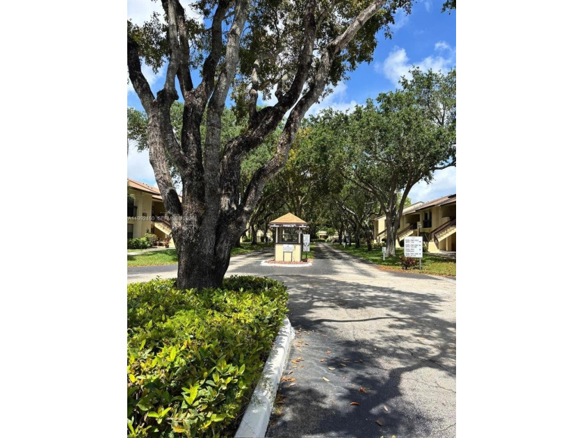 Wake up to peaceful garden views every day in this charming - Beach Condo for sale in Deerfield Beach, Florida on Beachhouse.com