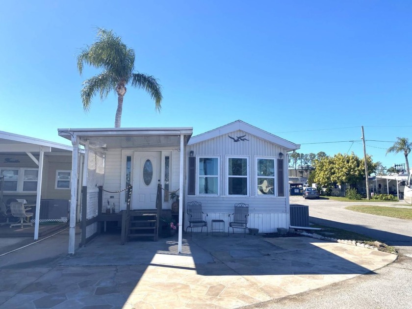 This 2 Bedroom, 1 Bath PARTIALLY FURNISHED LakeFront Home is in - Beach Home for sale in Holiday, Florida on Beachhouse.com