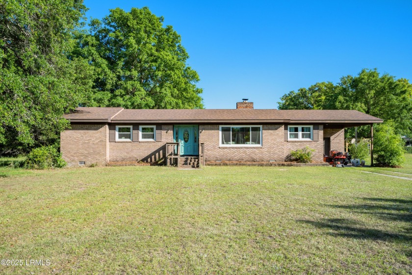Nestled on a spacious 1-acre lot near Station Creek Landing - Beach Home for sale in Saint Helena Island, South Carolina on Beachhouse.com