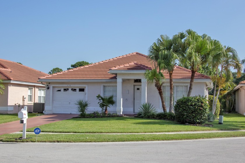 Nestled in the prestigious Atlantic National Golf and Country - Beach Home for sale in Lake Worth, Florida on Beachhouse.com