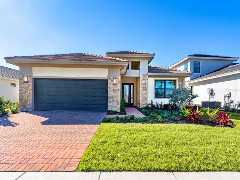This stunning brand-new, three-bedroom plus den residence of 2 - Beach Home for sale in Lakewood Ranch, Florida on Beachhouse.com