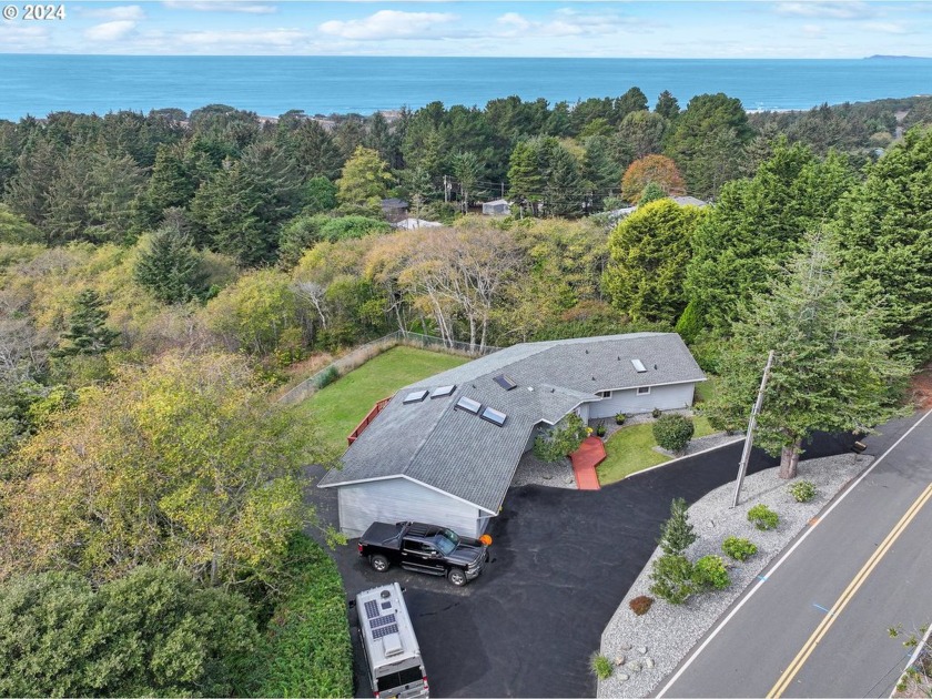 This stunning oceanview home offers a serene retreat on a mostly - Beach Home for sale in Gold Beach, Oregon on Beachhouse.com