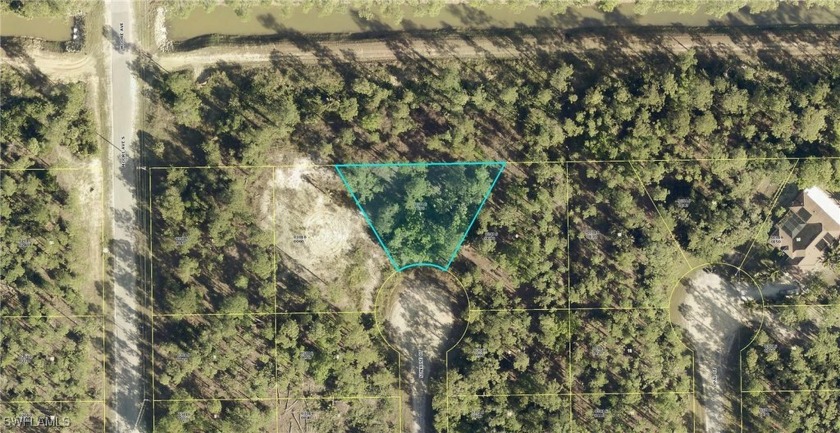 Nestled on a cul-de-sac and backing out to a serene, wooded area - Beach Lot for sale in Lehigh Acres, Florida on Beachhouse.com