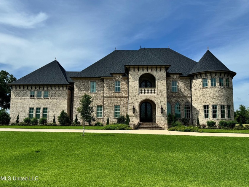 Your deserve a castle!  This elegant French inspired Tudor - Beach Home for sale in Pass Christian, Mississippi on Beachhouse.com