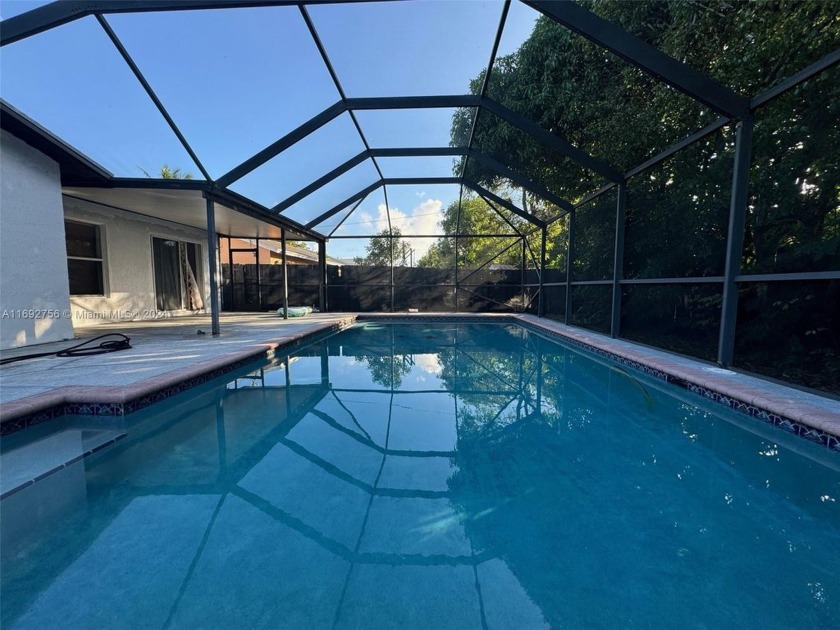 Enjoy Summer all year round by the pool.  This beautiful 4/3 - Beach Home for sale in Deerfield Beach, Florida on Beachhouse.com