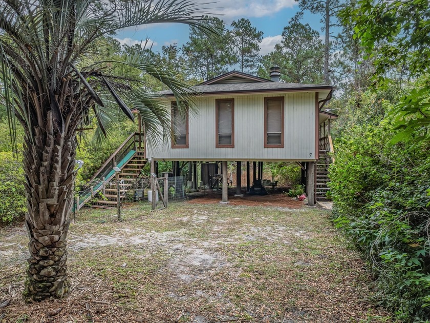 This beautifully maintained canal-front retreat comes fully - Beach Home for sale in Sopchoppy, Florida on Beachhouse.com