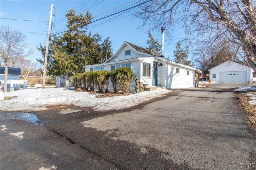 Nestled along the shores of Guffin Bay, this adorable 2-bedroom - Beach Home for sale in Brownville, New York on Beachhouse.com