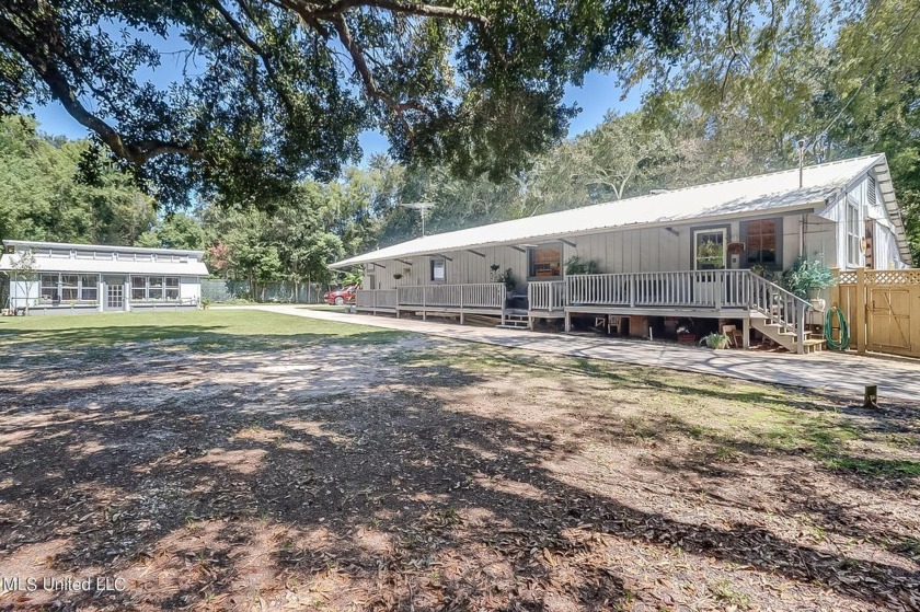 ***Must watch short drone video of site , ** The most unique - Beach Home for sale in Gulfport, Mississippi on Beachhouse.com