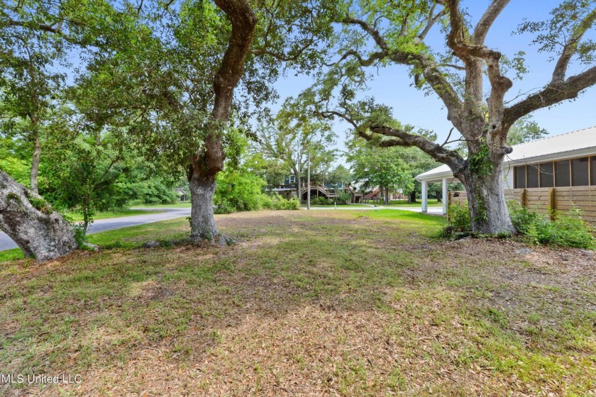 Corner lot adorned with magnificent live oaks, nestled in the - Beach Lot for sale in Bay Saint Louis, Mississippi on Beachhouse.com