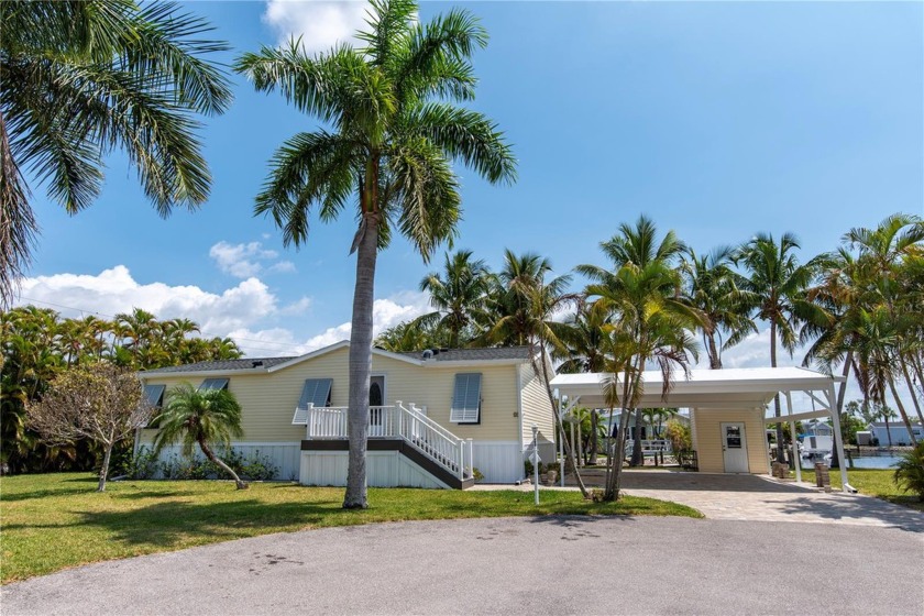 Welcome to your dream home in Windmill Village, a desirable 55+ - Beach Home for sale in Punta Gorda, Florida on Beachhouse.com