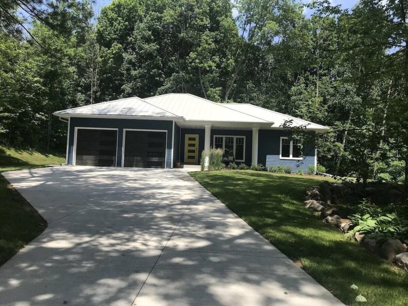 Absolutely gorgeous great room ranch nestled in the trees on the - Beach Home for sale in Sheboygan, Wisconsin on Beachhouse.com