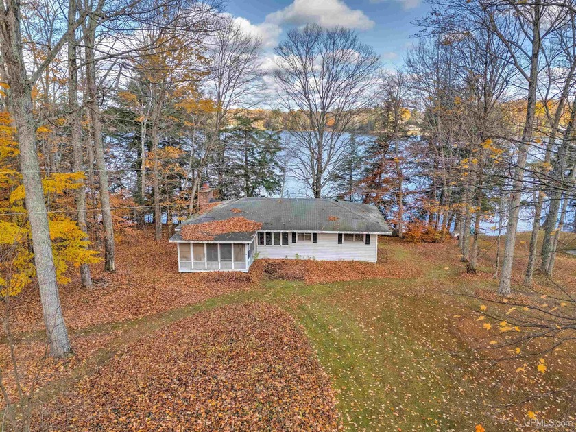 Sitting on a picturesque lot nestled in the hardwoods on the - Beach Home for sale in Manistique, Michigan on Beachhouse.com