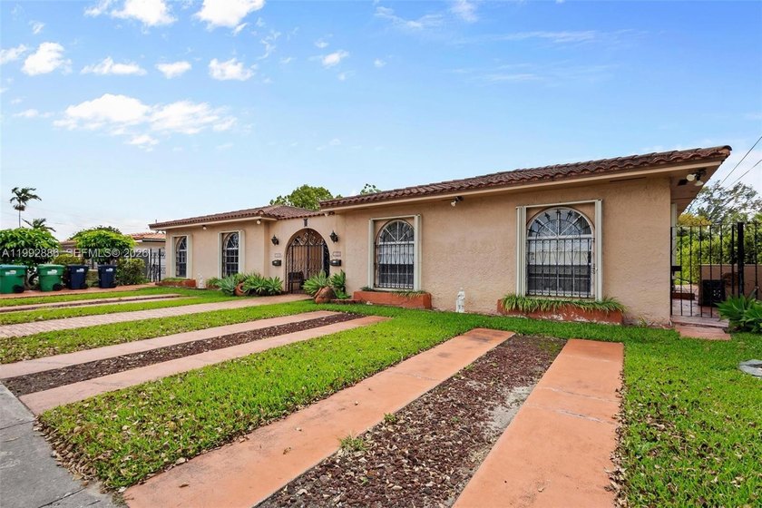 Step into this one-of-a-kind Spanish-style duplex designed for - Beach Townhome/Townhouse for sale in Miami, Florida on Beachhouse.com
