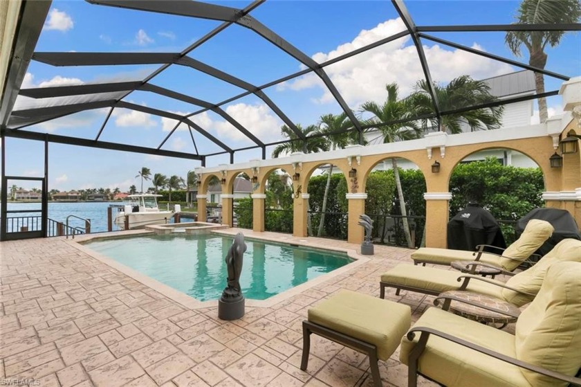 Paradise found! This 4-bed, 3-bath canal front gem offers a - Beach Home for sale in Marco Island, Florida on Beachhouse.com