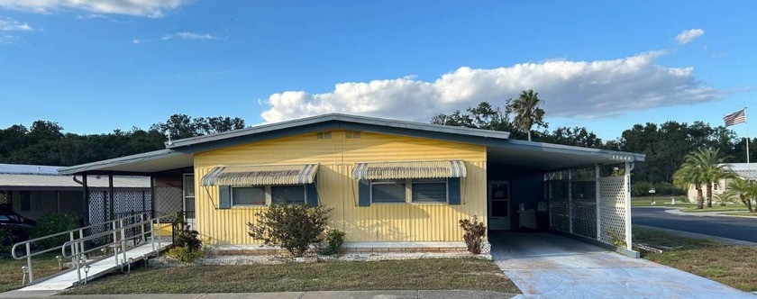 WELCOME HOME TO THIS 2-BEDROOM 2-BATH SANCTUARY WITH A BRIGHT - Beach Home for sale in New Port Richey, Florida on Beachhouse.com