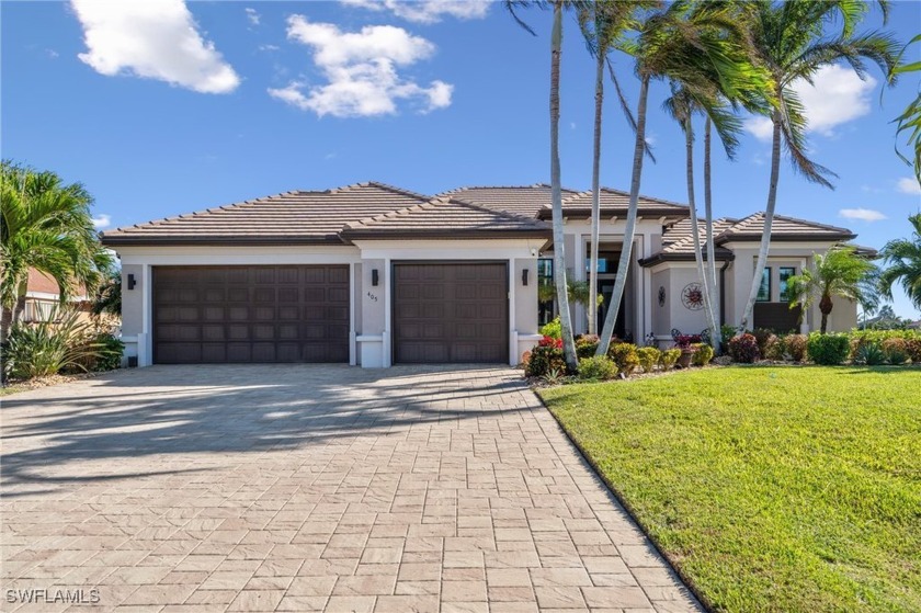 This Stunning 3-bedroom + den, 2-bathroom home with a 3-car - Beach Home for sale in Cape Coral, Florida on Beachhouse.com