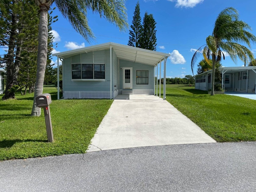 Experience the charm of this beautifully furnished mobile home - Beach Home for sale in Fort Pierce, Florida on Beachhouse.com